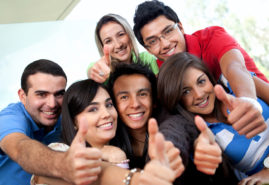 Students with thumbs up Group of students at the university with thumbs up